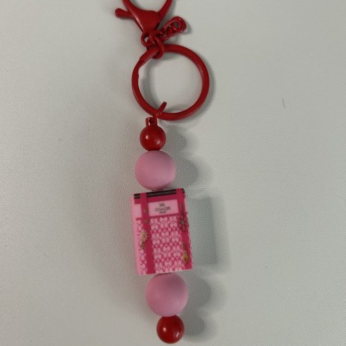 Pink Coach Book Bar Keychain